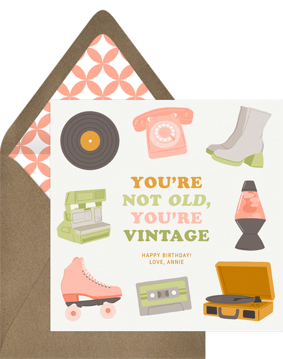 Sweet and modern birthday card. The card features mod hand-drawn illustrations of a record player, a telephone, a lava lamp, platform boots, roller skates and more. The birthday message reads, "You're not old, you're vintage."